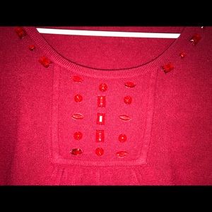 Red sweater with jewels accents